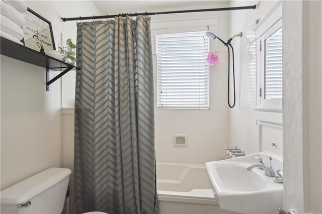 bathroom with plenty of natural light, sink, and toilet