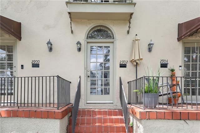 2900-04 Esplanade Ave, New Orleans, LA 70119 - entrance to property with stucco siding and a porch
