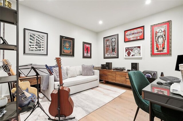 office area with light hardwood / wood-style floors