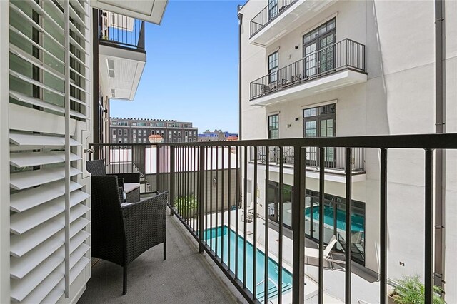 balcony with a community pool