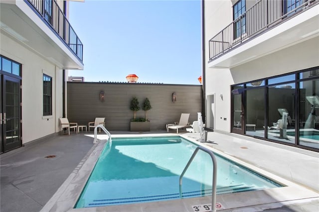 view of pool featuring a patio