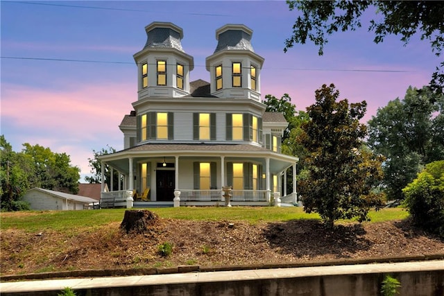 victorian house featuring covered porch