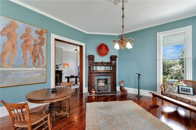 interior space featuring an inviting chandelier, dark wood-type flooring, and ornamental molding