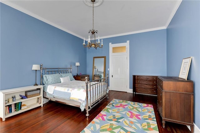 bedroom featuring a chandelier, wood finished floors, and ornamental molding