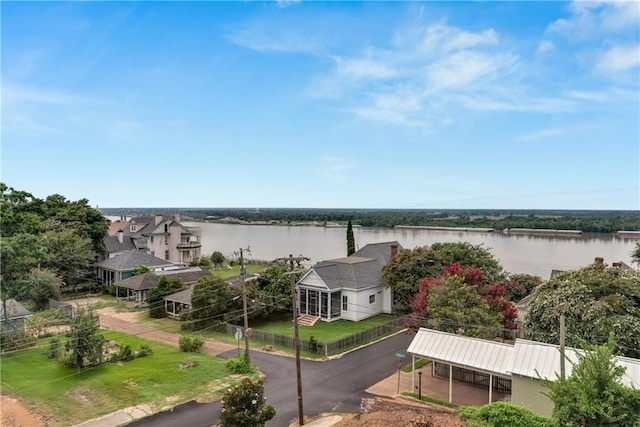 birds eye view of property with a water view