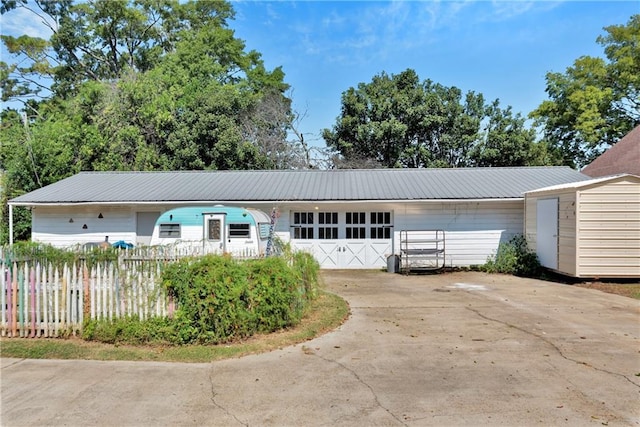 single story home with a garage