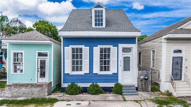 1915 Governor Nicholls St, New Orleans, LA 70116 - view of front of house with entry steps and a shingled roof