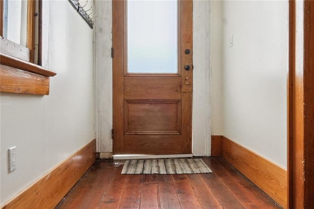 doorway to outside featuring dark wood finished floors