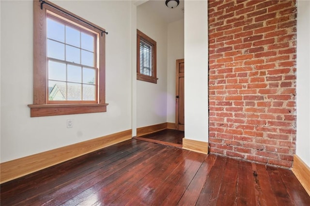 1915 Governor Nicholls St, New Orleans, LA 70116 - empty room with hardwood / wood-style flooring and baseboards