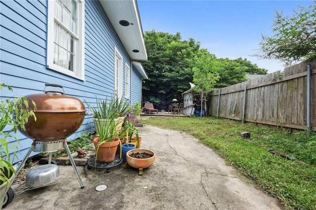 view of yard with a patio and fence