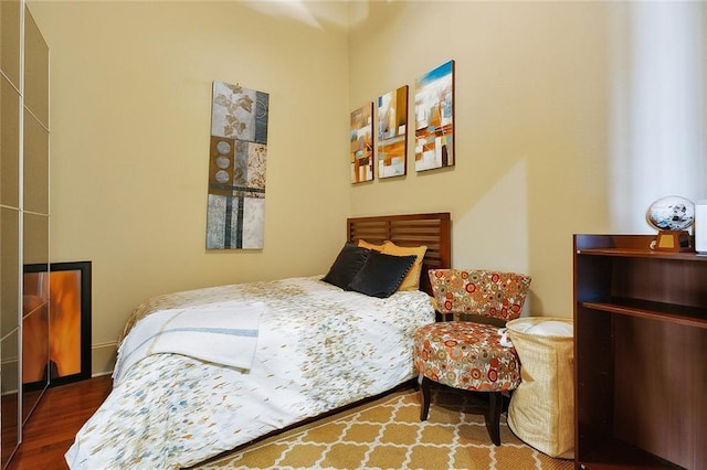 bedroom with wood finished floors