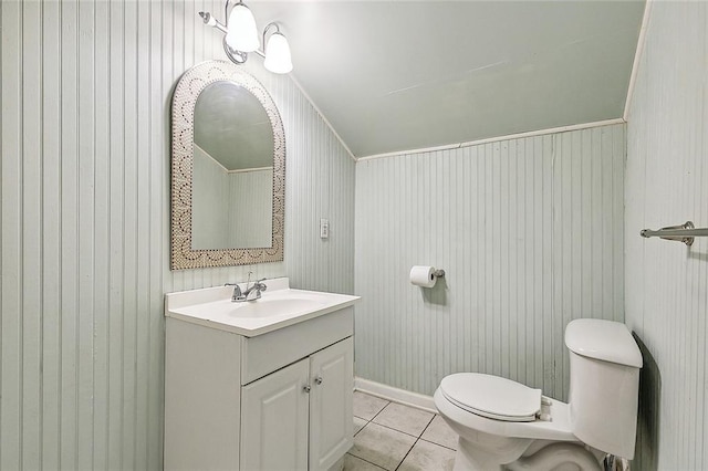 bathroom featuring tile patterned floors, toilet, and vanity