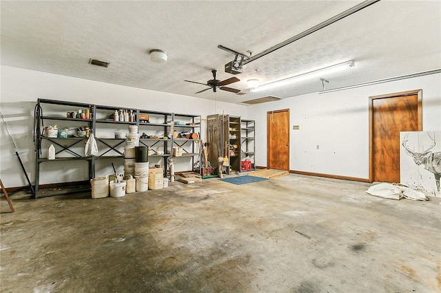 116 Villary St, Belle Chasse, LA 70037 - garage featuring a garage door opener, a ceiling fan, and baseboards