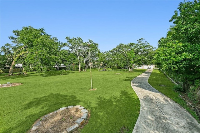 116 Villary St, Belle Chasse, LA 70037 - view of property's community with a yard and view of wooded area