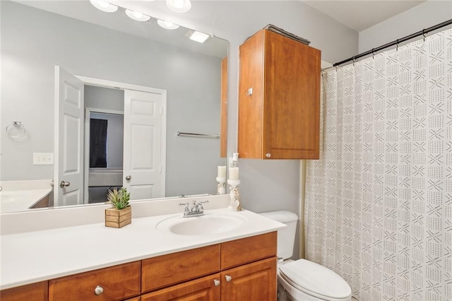 bathroom featuring vanity and toilet