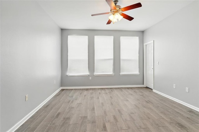 unfurnished room featuring ceiling fan and light wood-type flooring