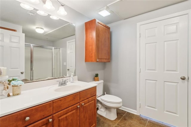 bathroom with a shower with door, vanity, and toilet