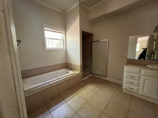 bathroom with tile patterned flooring, independent shower and bath, vanity, and ornamental molding