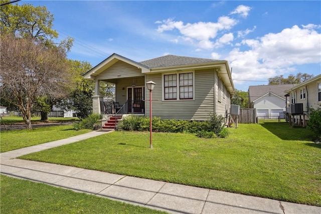 bungalow-style home featuring a front lawn