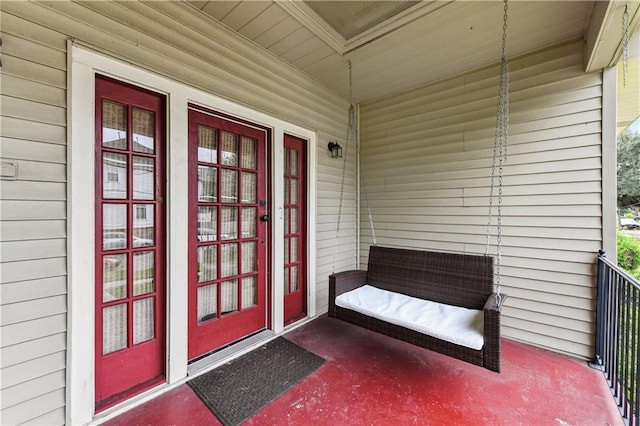 property entrance featuring a porch