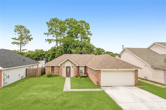 single story home with a garage and a front lawn