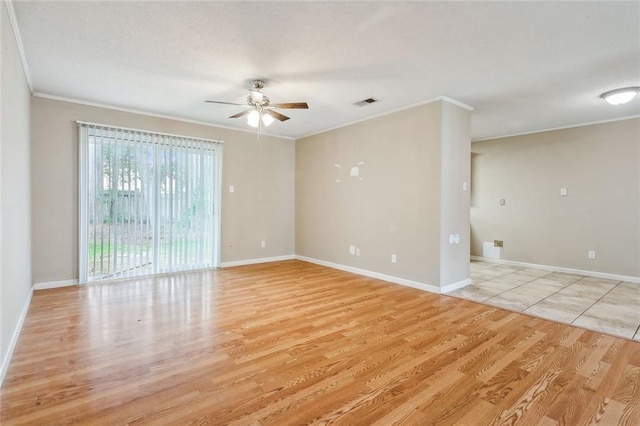 spare room featuring crown molding, ceiling fan, and light wood-type flooring