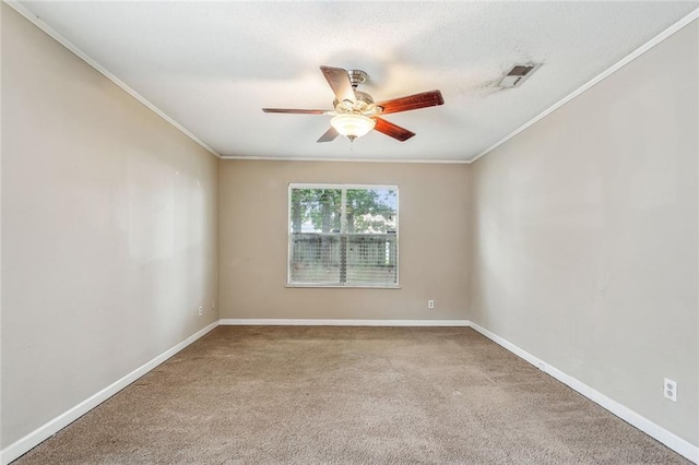 carpeted empty room with crown molding and ceiling fan