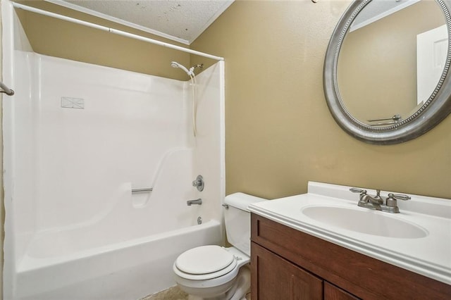 full bathroom with bathtub / shower combination, toilet, a textured ceiling, ornamental molding, and vanity