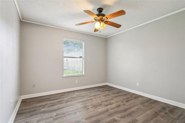 empty room featuring ornamental molding, wood-type flooring, and a textured ceiling