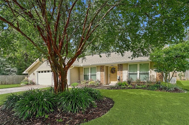 ranch-style house with a garage and a front yard