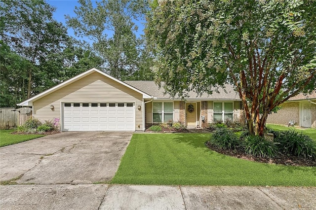 single story home with a garage and a front lawn