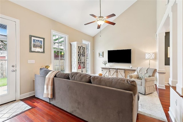 living area featuring high vaulted ceiling, wood finished floors, baseboards, and ceiling fan