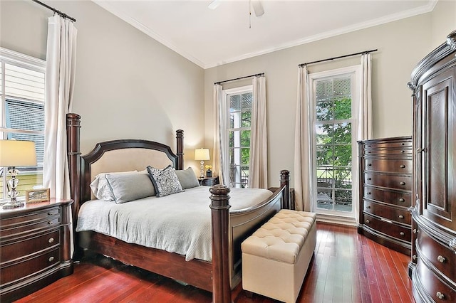 bedroom with crown molding, dark hardwood / wood-style floors, and ceiling fan