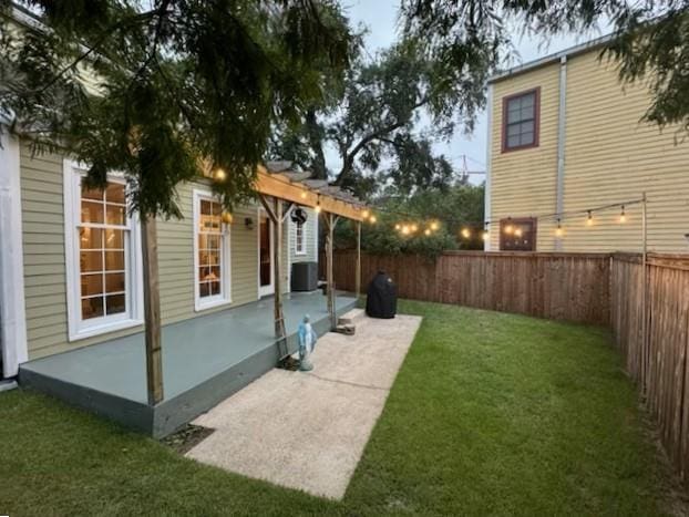 view of yard featuring a patio, cooling unit, and a pergola