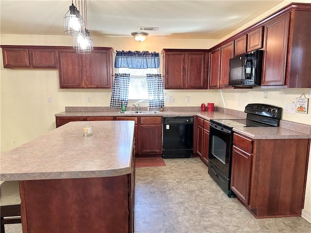 kitchen featuring black appliances, a kitchen island, sink, and pendant lighting