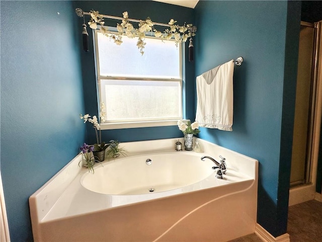 bathroom with shower with separate bathtub