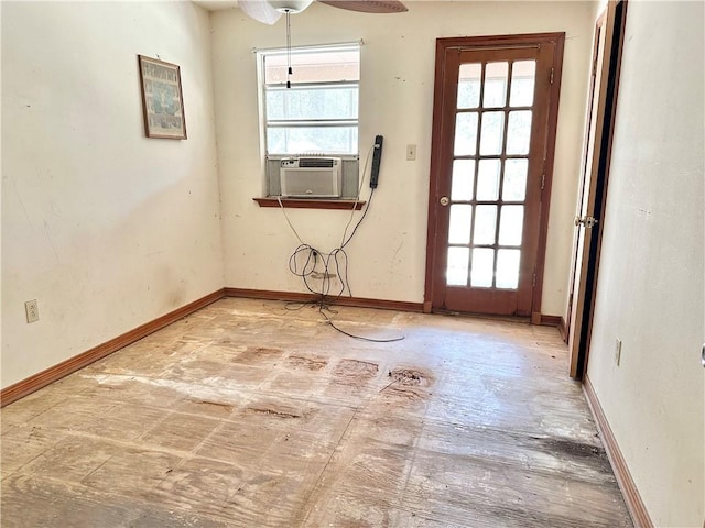 spare room featuring cooling unit and ceiling fan