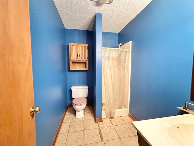 bathroom with a textured ceiling, vanity, toilet, and a shower with curtain