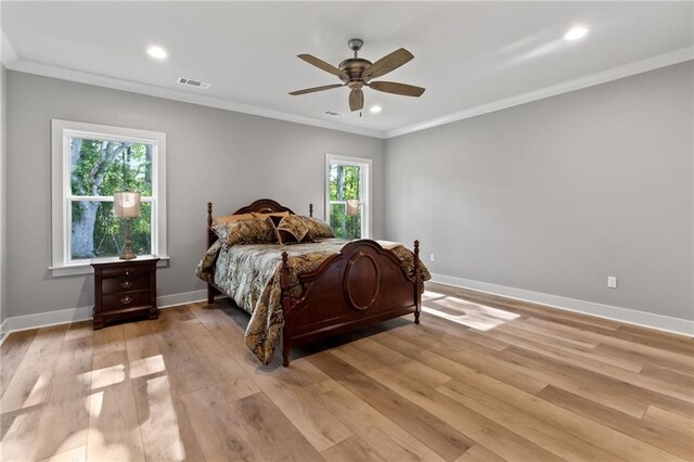bedroom with visible vents, baseboards, light wood-type flooring, recessed lighting, and ornamental molding
