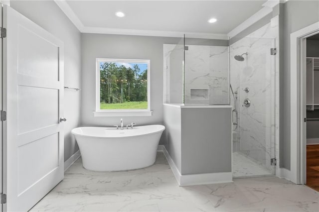 full bathroom with a marble finish shower, a freestanding tub, marble finish floor, and baseboards