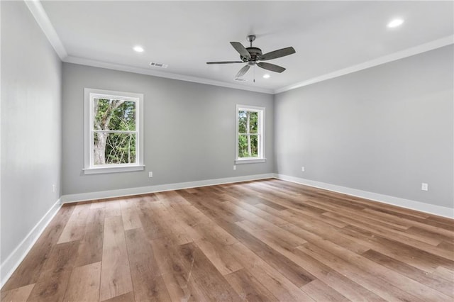 unfurnished room featuring ornamental molding, ceiling fan, and light wood-type flooring