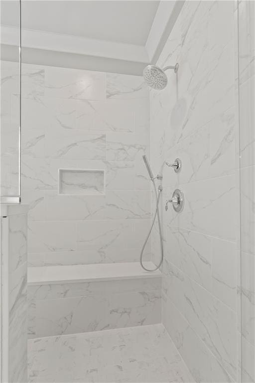 bathroom featuring a tile shower