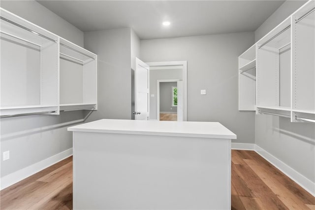 spacious closet featuring light wood-type flooring