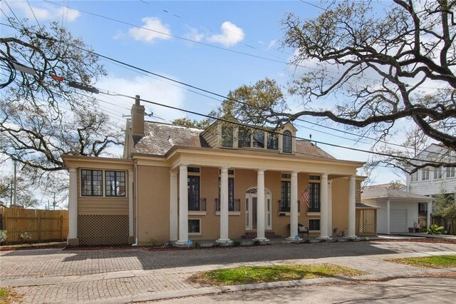 view of front of property with a porch and a garage