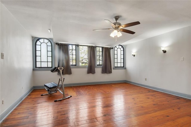 exercise area featuring hardwood / wood-style floors and ceiling fan