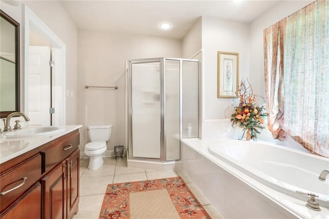 full bathroom featuring toilet, tile patterned floors, shower with separate bathtub, and vanity