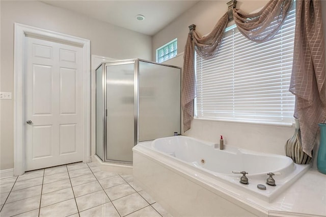 bathroom with tile patterned floors and plus walk in shower