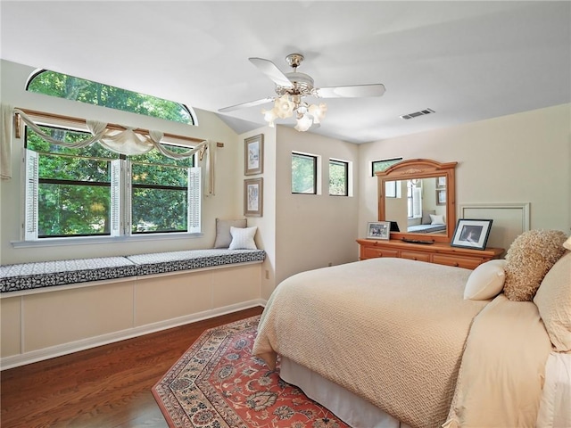 bedroom with dark hardwood / wood-style floors and ceiling fan