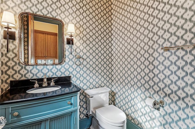 bathroom featuring vanity and toilet