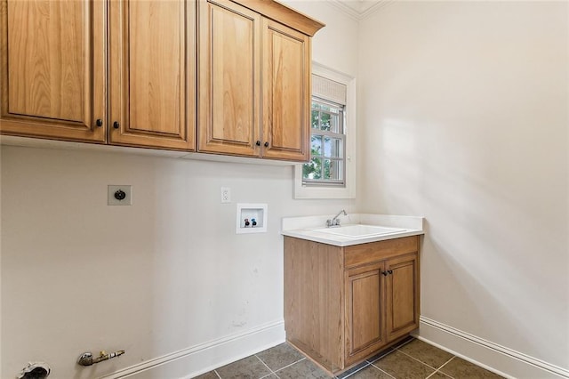 clothes washing area with sink, hookup for a gas dryer, cabinets, washer hookup, and hookup for an electric dryer